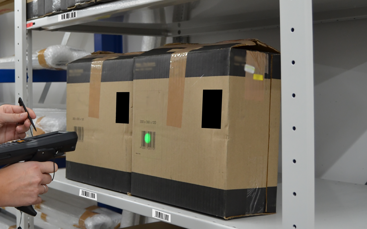 Warehouse picking illustration showing a barcode scanner used to confirm item withdrawals.