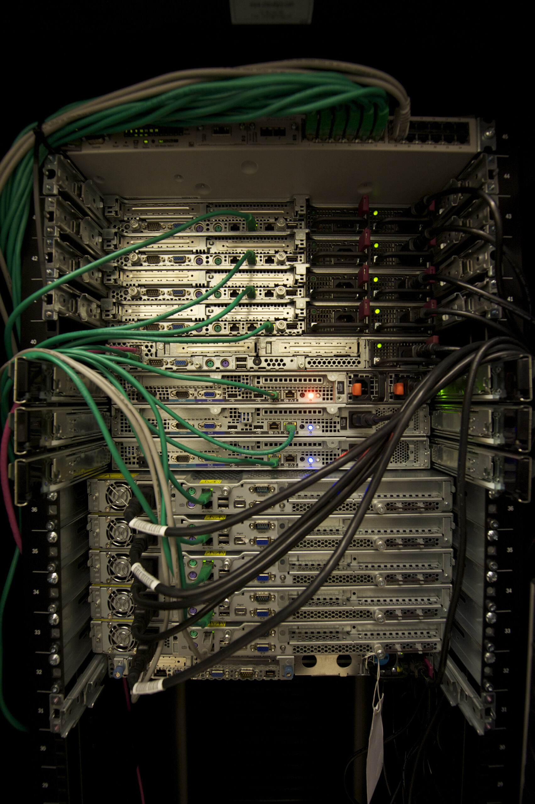 Rack-mounted servers with visible cables and equipment panels.